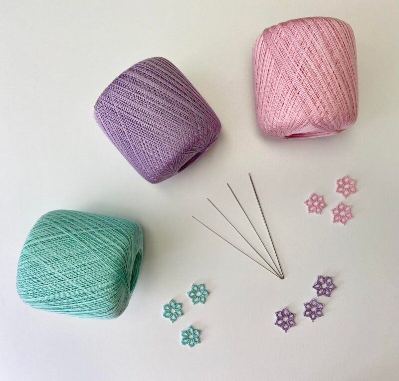 spools of crochet thread and tatting needles