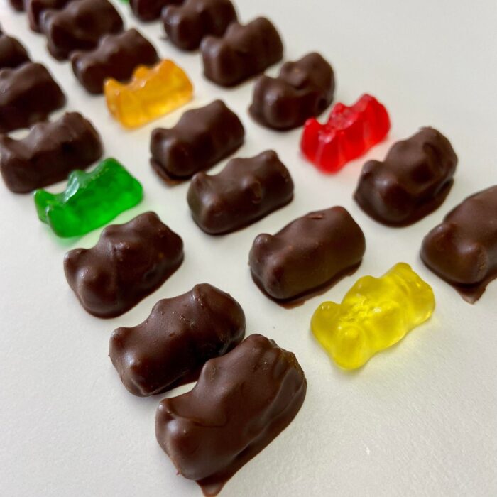 chocolate covered gummy bears on a table