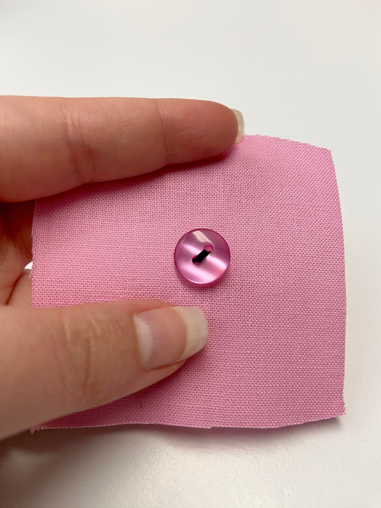 How to Sew on a Four or Two Hole Button by Hand