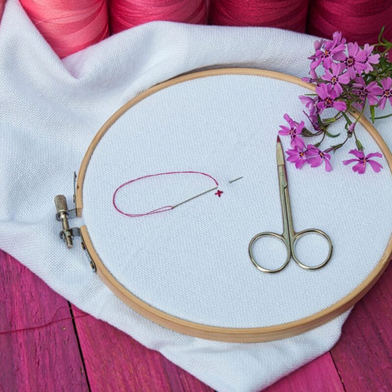 Embroidery on a pink table