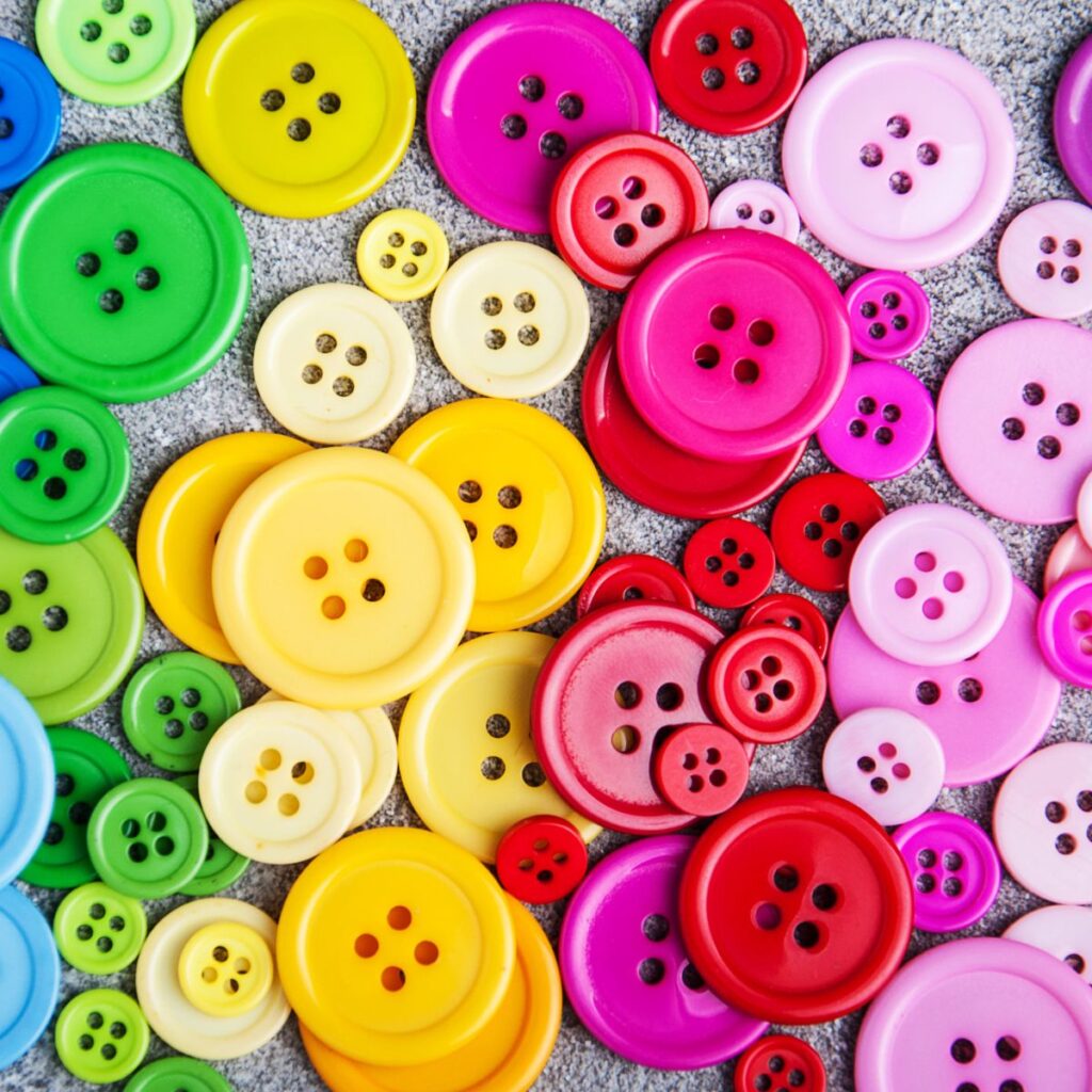 multi colored buttons on a table