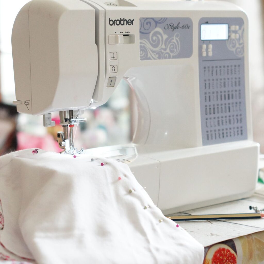 Sewing machine and white fabric.
