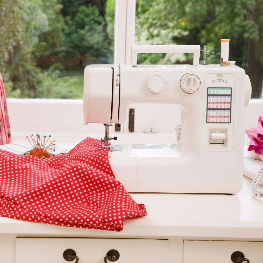 Sewing machine with red polka dot fabric.